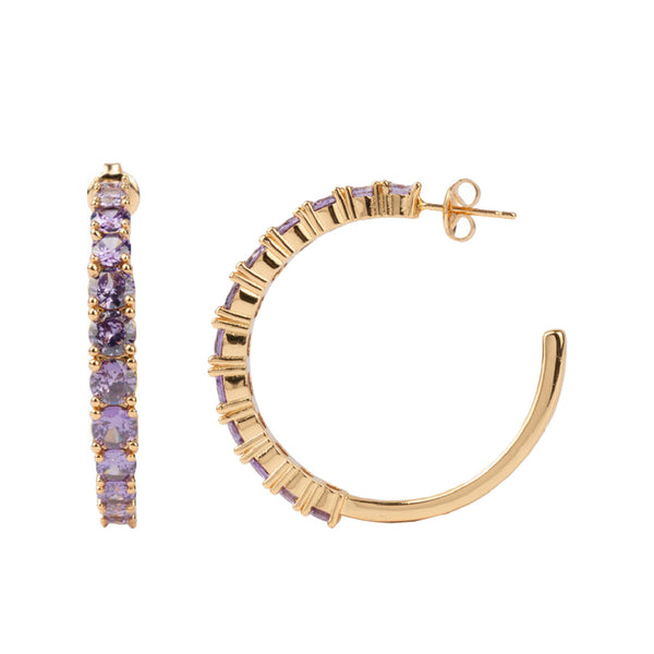 The big gem hoop earrings in gold and purple colour from the brand ALL THE LUCK IN THE WORLD