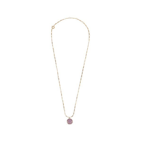 The coin smiley necklace in gold and purple colour from the brand ALL THE LUCK IN THE WORLD