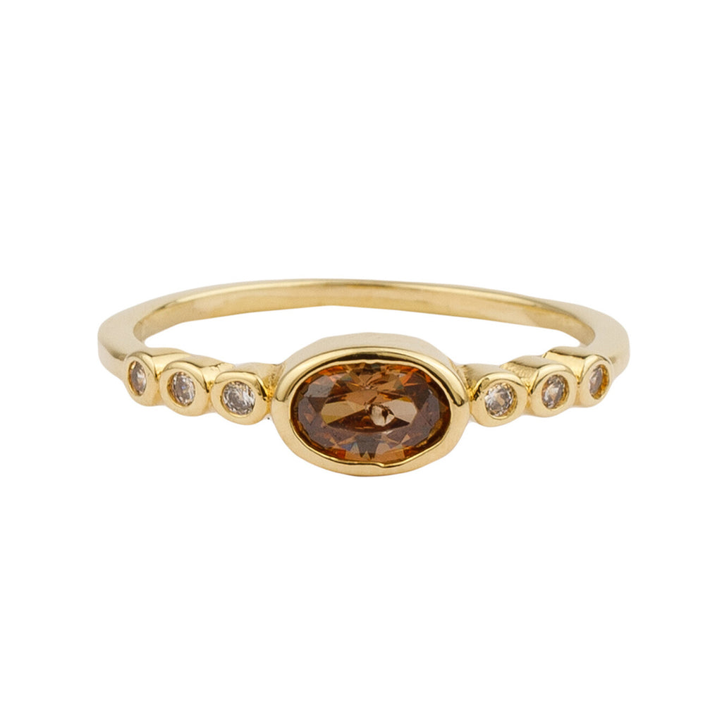 The ellips ring in gold and brown color from the brand ALL THE LUCK IN THE WORLD