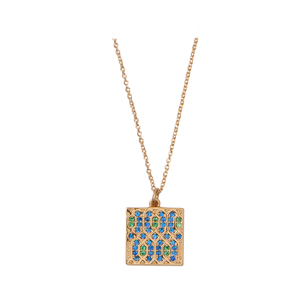 The graphic square necklace in gold, green and blue colour from the brand ALL THE LUCK IN THE WORLD