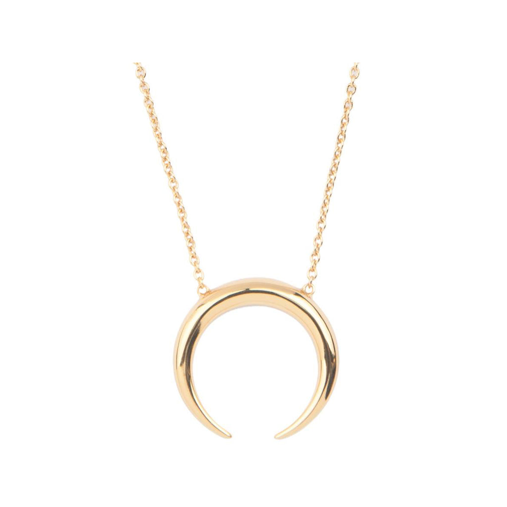 The horn necklace in gold colour from the brand ALL THE LUCK IN THE WORLD