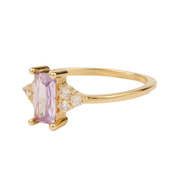 The rectangle ring in gold, purple and clear colour from the brand ALL THE LUCK IN THE WORLD