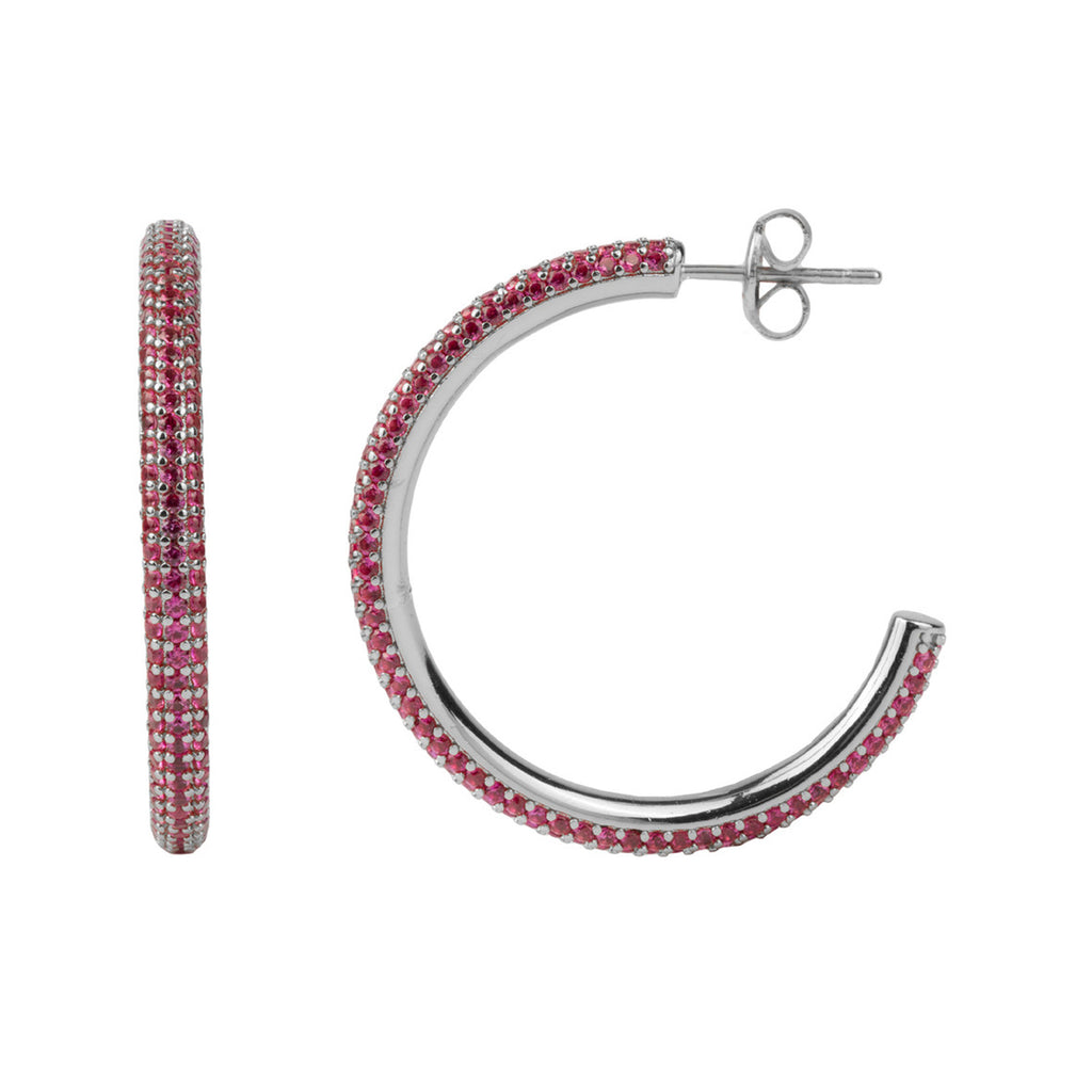 The round hoop earrings in silver and rose colour from the brand ALL THE LUCK IN THE WORLD