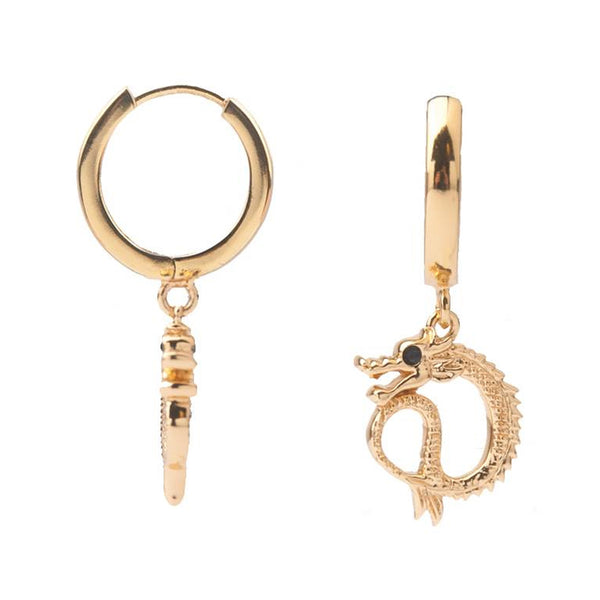 The small dragon earrings in gold colour from the brand ALL THE LUCK IN THE WORLD