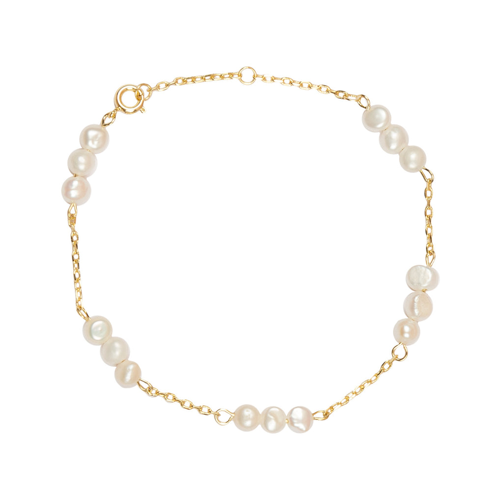 The three pearls bracelet in gold and pearl colour from the brand ALL THE LUCK IN THE WORLD