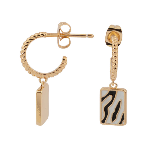 The zebra rectangle earrings in gold, white and black colour from the brand ALL THE LUCK IN THE WORLD