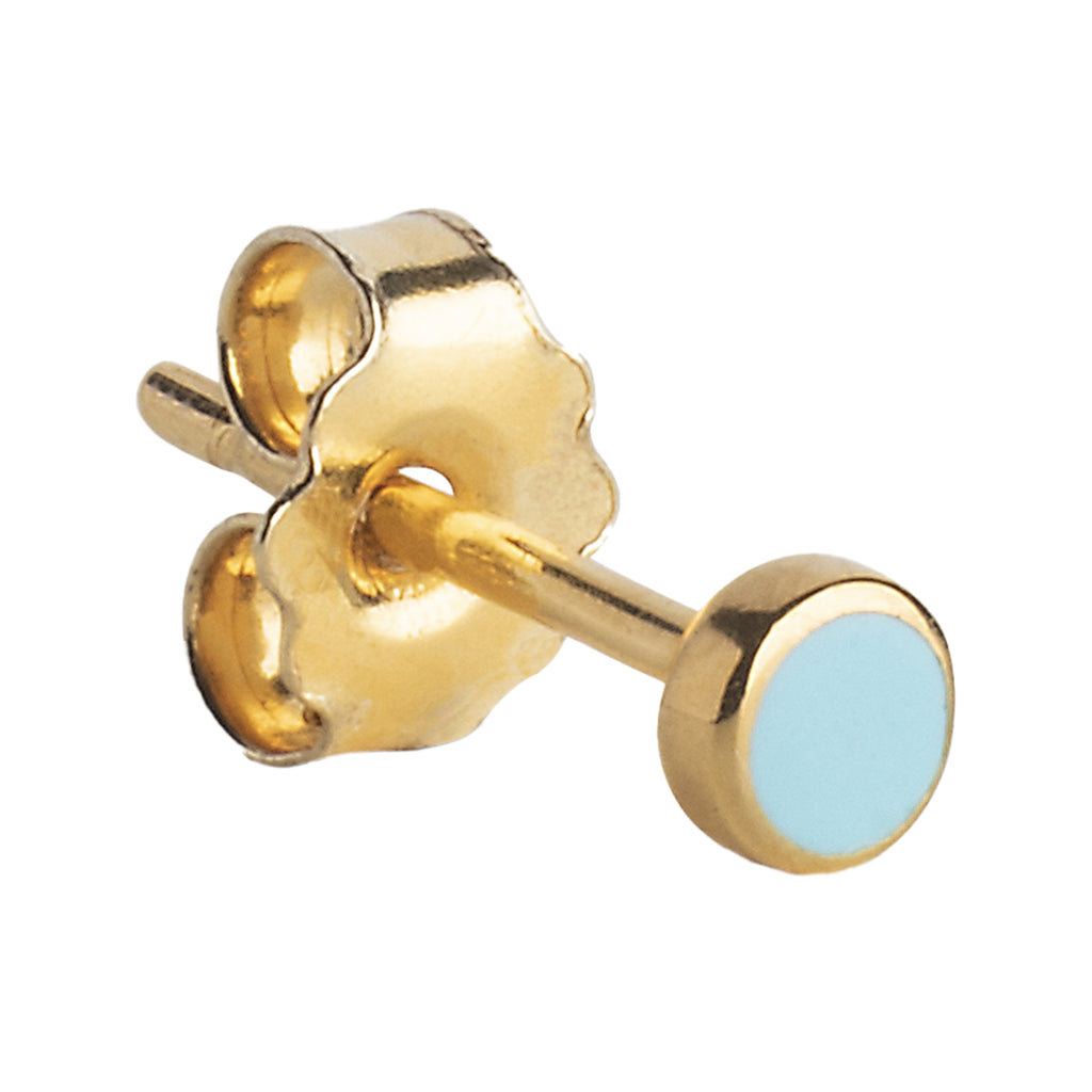 The dot stud single earring in gold and icy-blue colour from the brand ENAMEL COPENHAGEN