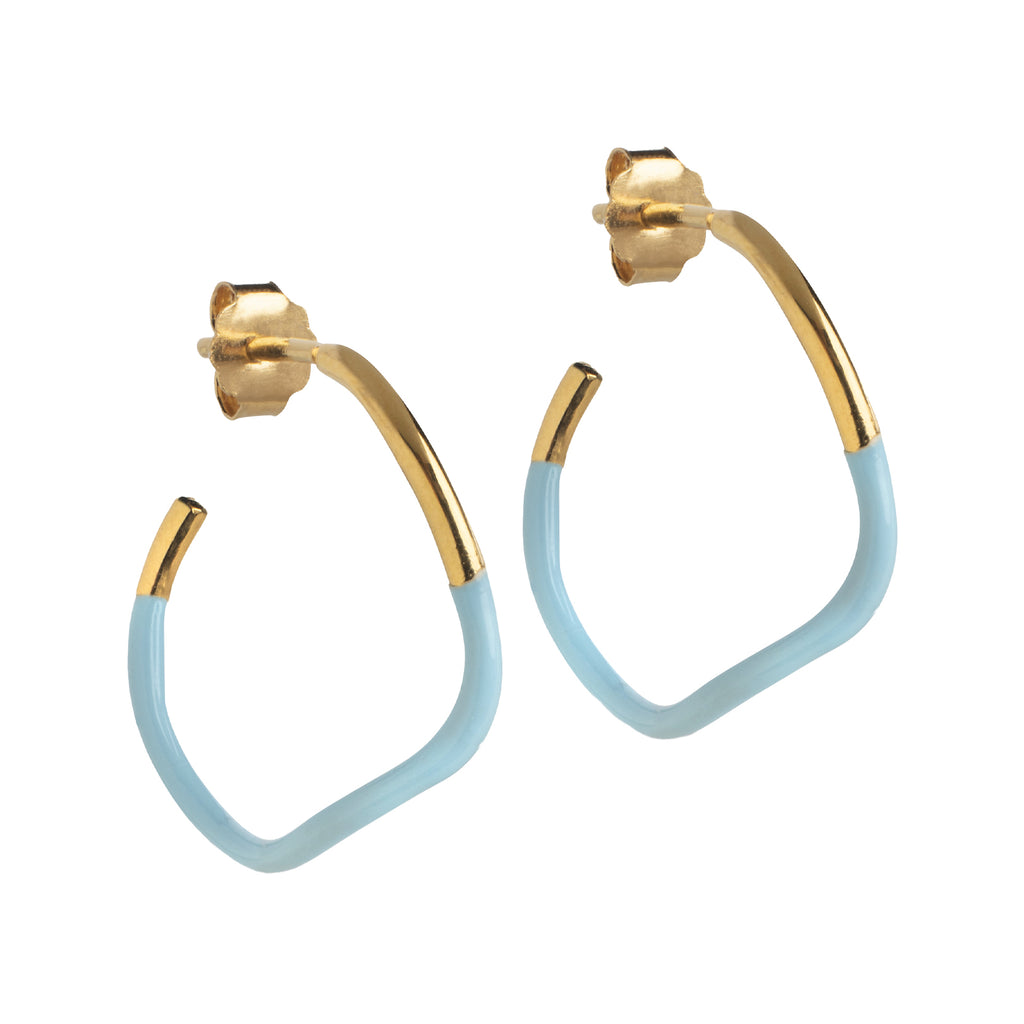 The sway hoop earrings in gold and icy-blue colour from the brand ENAMEL COPENHAGEN