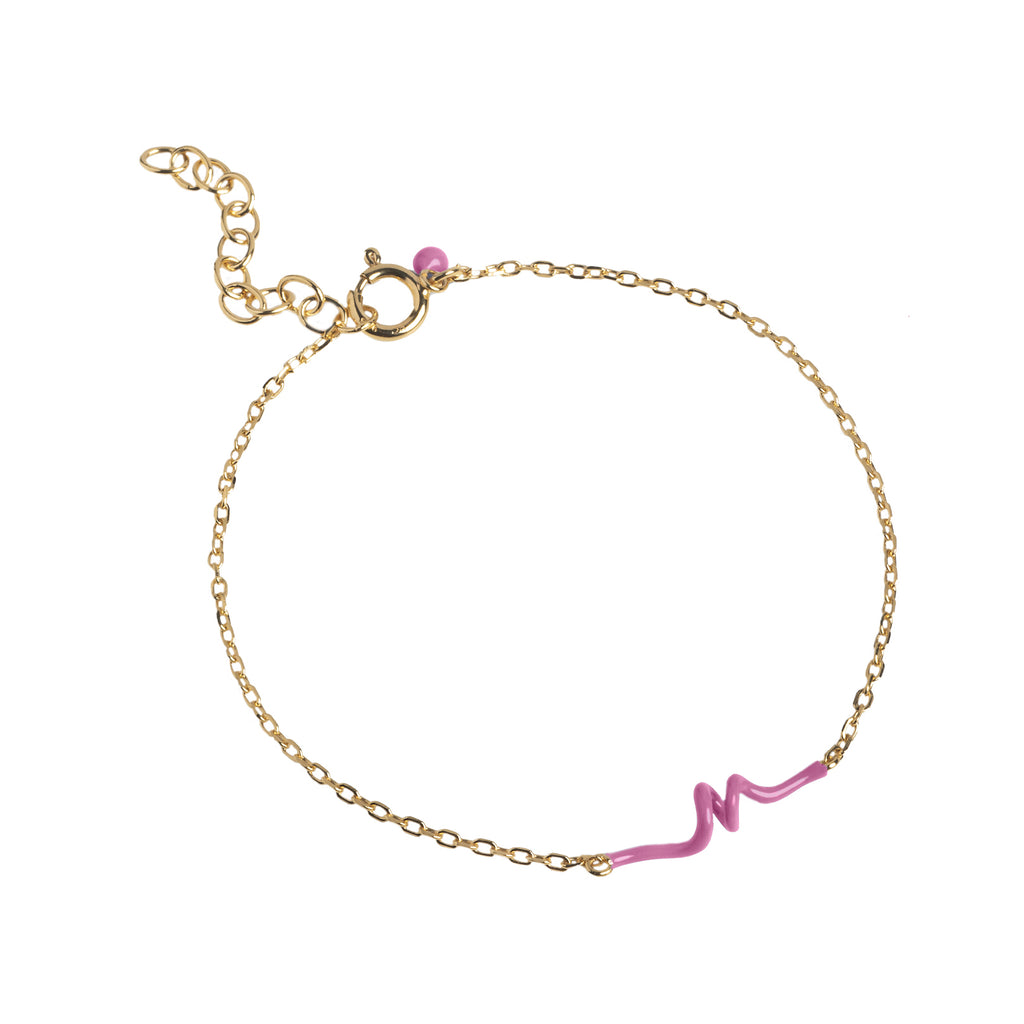 The twist bracelet in gold and pink colour from the brand ENAMEL COPENHAGEN