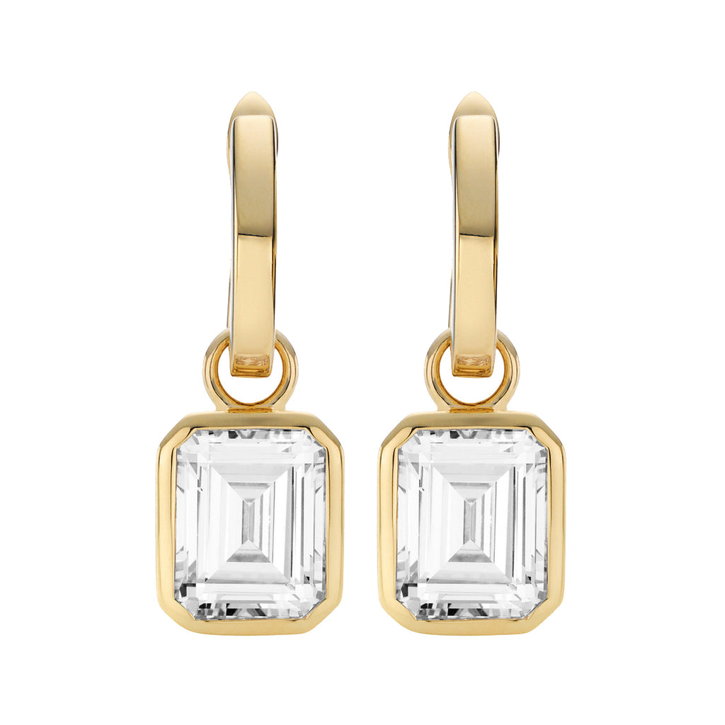 The Emerald Cut drop earrings in gold and clear colours from the brand HEAVENLY LONDON