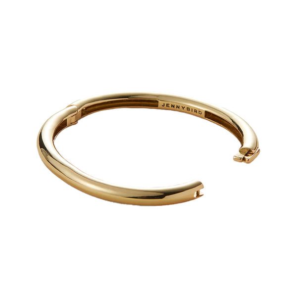 The Gia bangle bracelet in gold colour from the brand JENNY BIRD