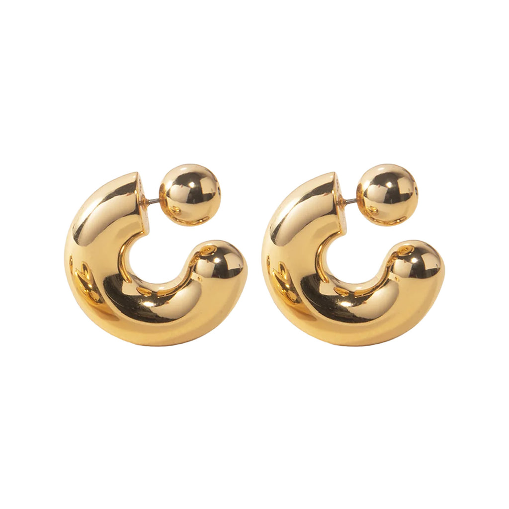 The Tome large hoop earrings in gold colour from the brand JENNY BIRD