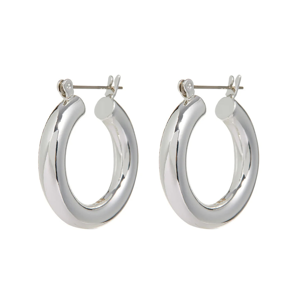 The baby Amalfi tube hoop earrings in silver colour from the brand LUV AJ