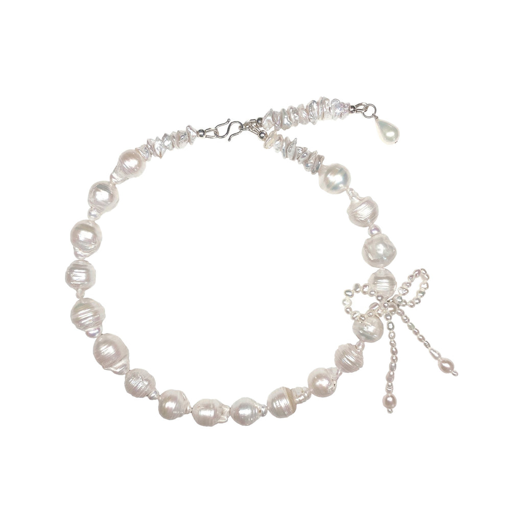 The Chasing Her Dreams necklace in silver and pearl colours from the brand MARGAUX STUDIOS