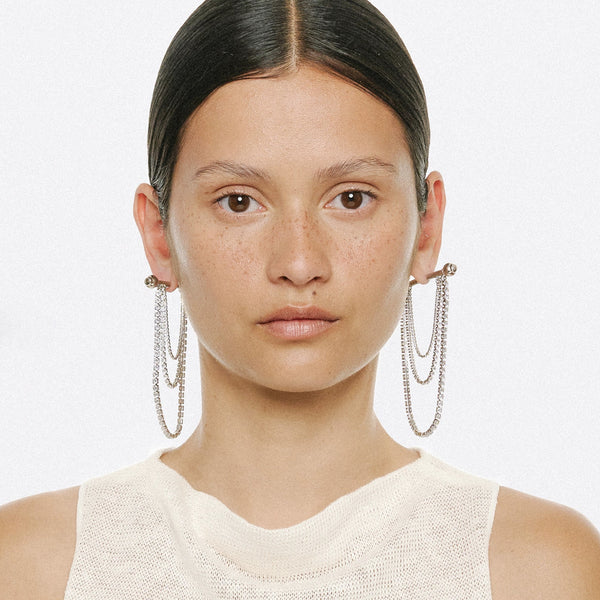 Model wearing the Barbell Chandelier earrings in silver colour from the brand PANCONESI