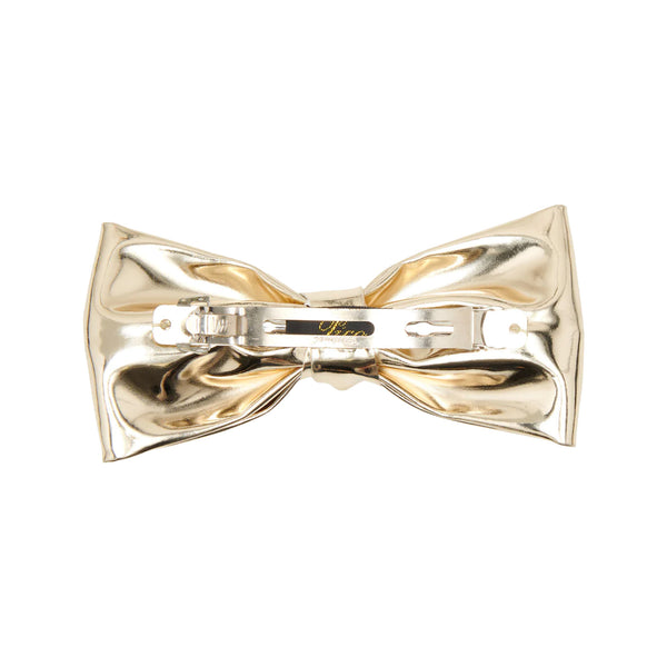 The Kiki bow clip in gold colour from the brand PICO COPENHAGEN